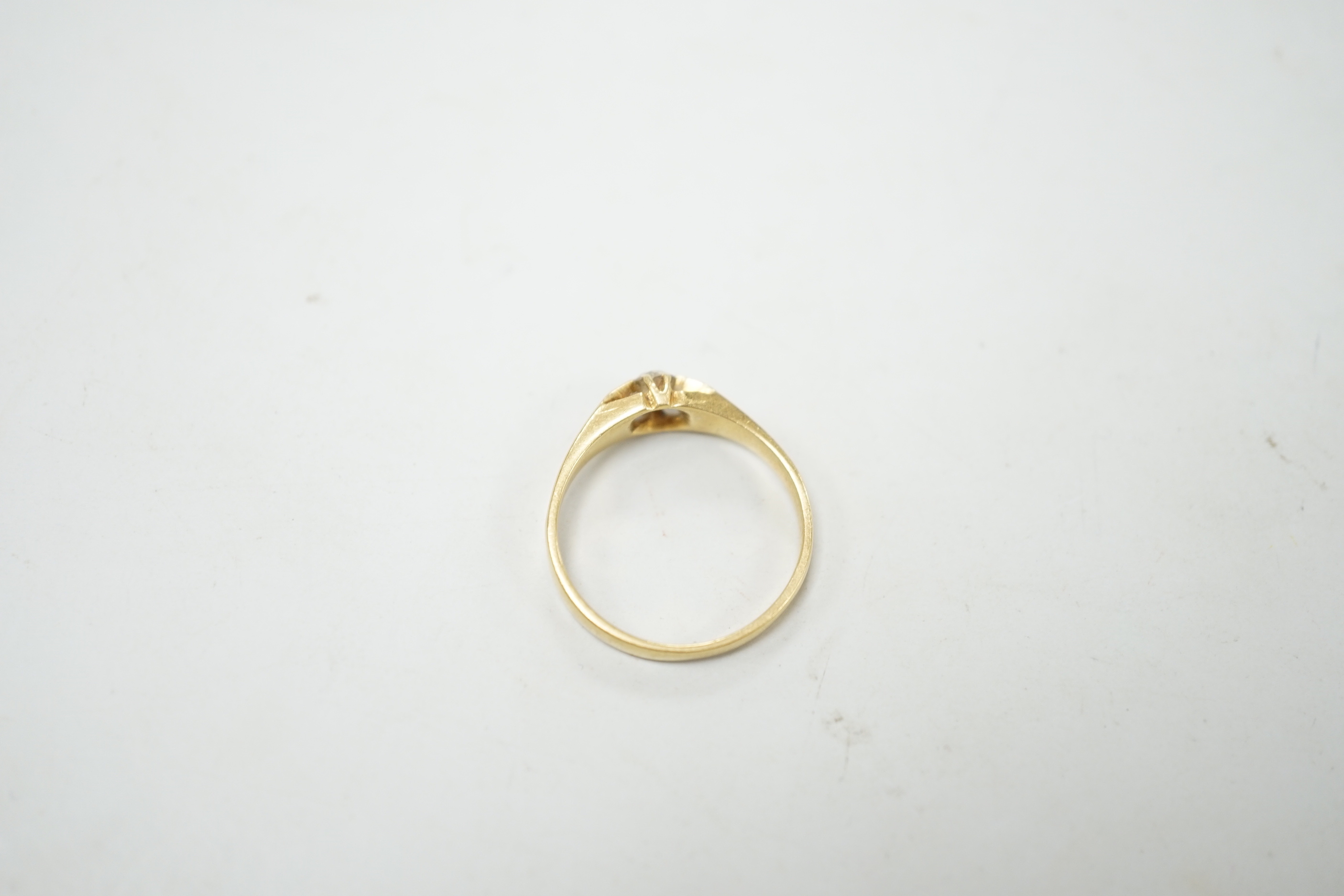 A George V 18ct gold and claw set solitaire diamond ring, size P, gross weight 3 grams.